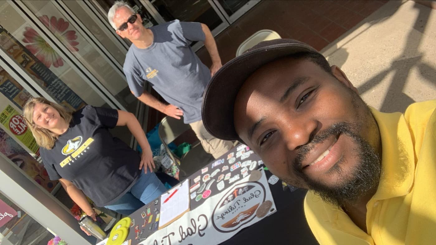 Students at a downtown outreach table