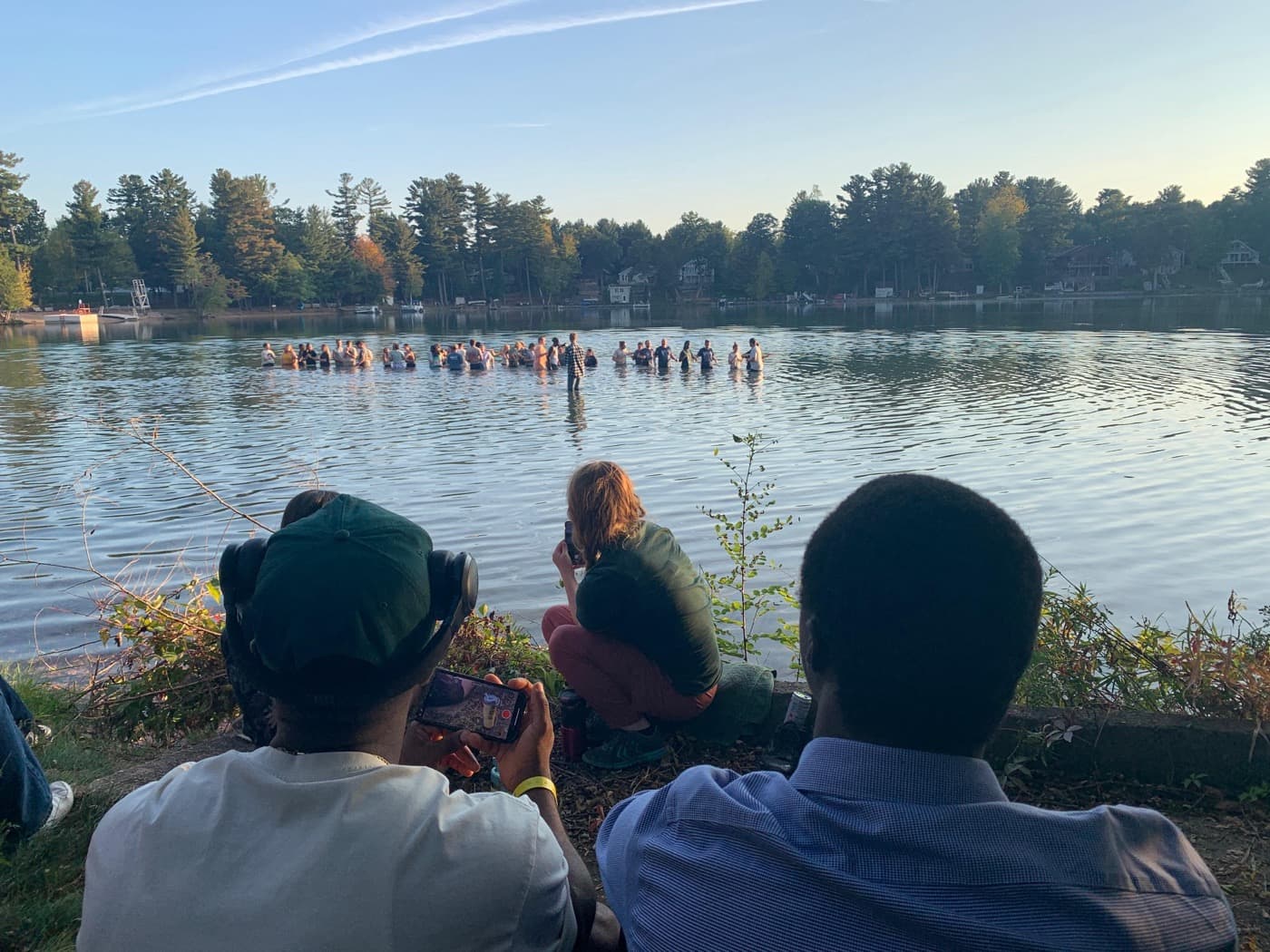 Group gathered in a lake for baptism