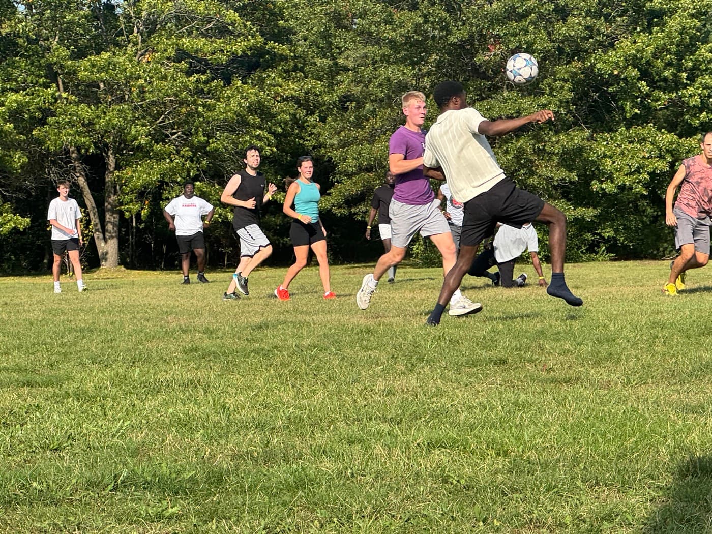 Group playing soccer at retreat